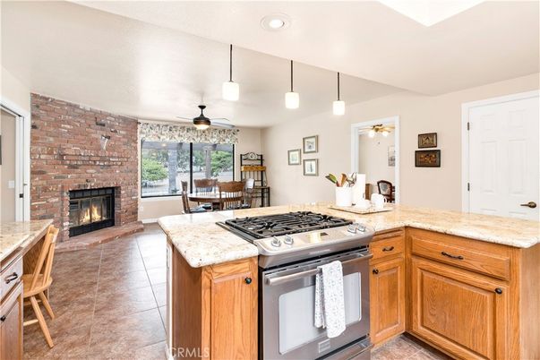 Dining room, Fireplace, Interior, Kitchen, Pendant Lights, Recessed Lighting, Stainless Steel Appliances, Stone Walls