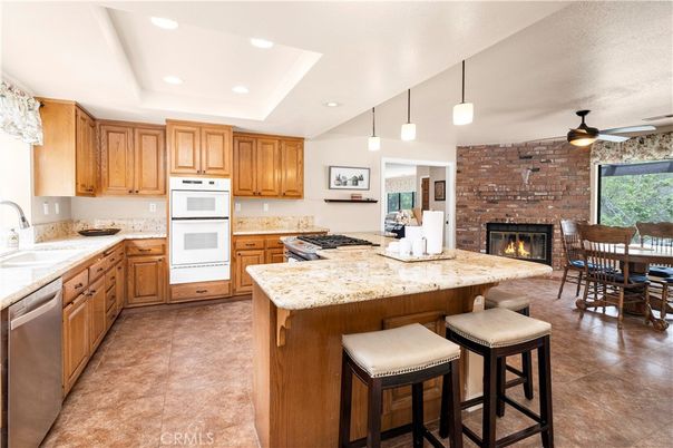 Dining room, Fireplace, Interior, Kitchen, Pendant Lights, Recessed Lighting, Stainless Steel Appliances, Stone Walls