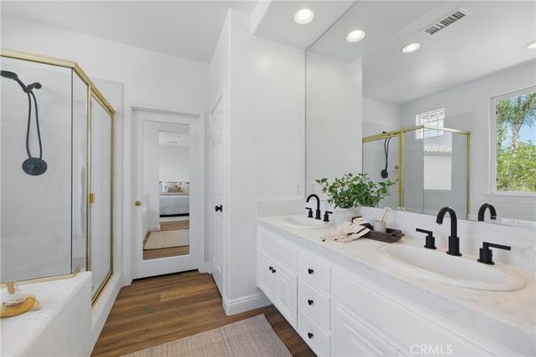 Bathroom, Dual Sink Vanities, Glass Shower, Interior, Recessed Lighting, Wood Texture Flooring