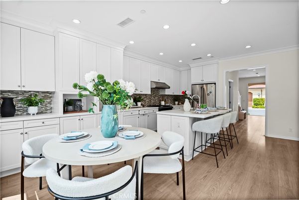 Dining room, Interior, Kitchen, Recessed Lighting, Stainless Steel Appliances, Wood Texture Flooring