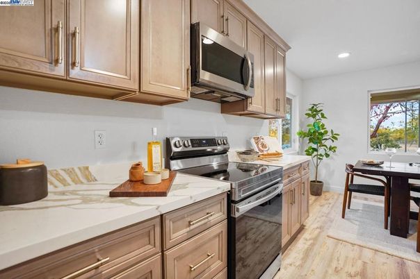 Dining room, Interior, Kitchen, Recessed Lighting, Stainless Steel Appliances, Wood Texture Flooring