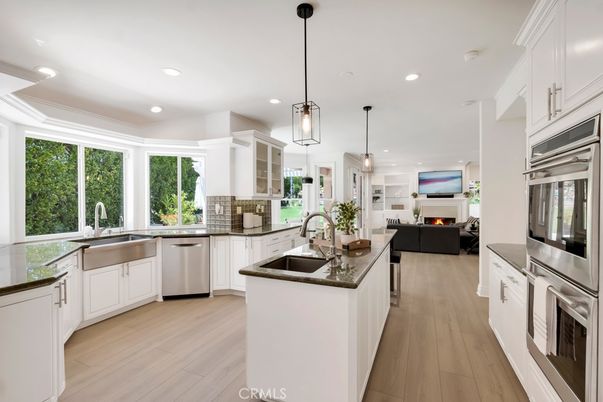 Fireplace, Interior, Kitchen, Living room, Pendant Lights, Recessed Lighting, Stainless Steel Appliances, Wood Texture Flooring
