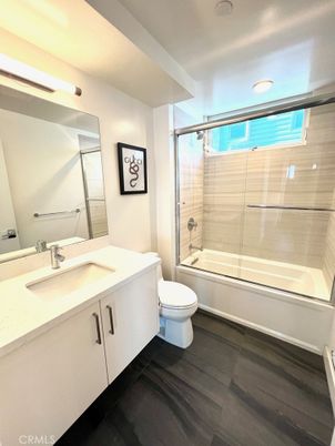 Bathroom, Dual Sink Vanities, Glass Shower, Interior, Recessed Lighting, Wood Texture Flooring