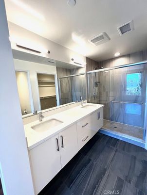 Bathroom, Dual Sink Vanities, Glass Shower, Interior, Recessed Lighting, Wood Texture Flooring