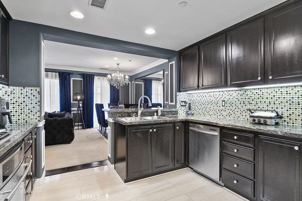 Chandelier, Dining room, Interior, Kitchen, Living room, Recessed Lighting, Stainless Steel Appliances, Wood Texture Flooring
