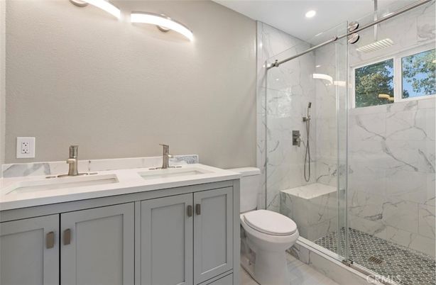 Bathroom, Dual Sink Vanities, Glass Shower, Interior, Marble Walls, Recessed Lighting