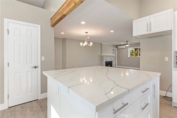 Chandelier, Fireplace, Interior, Kitchen, Pendant Lights, Recessed Lighting, Wooden Beams, Wood Texture Flooring