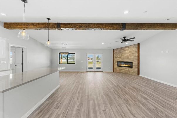 Empty room, Fireplace, Interior, Pendant Lights, Recessed Lighting, Stone Walls, Wood Texture Flooring