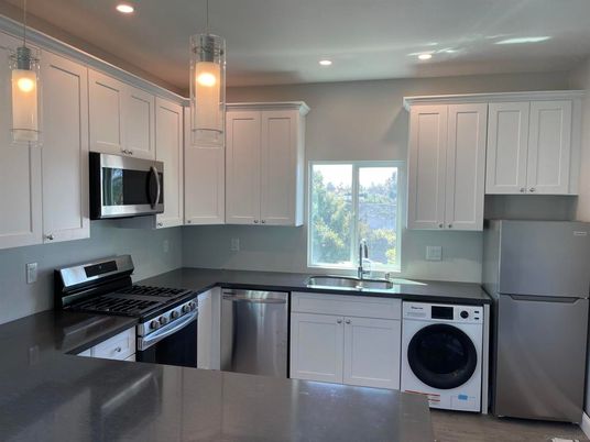 Interior, Kitchen, Pendant Lights, Recessed Lighting, Stainless Steel Appliances, Washer, Wood Texture Flooring