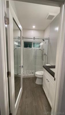 Bathroom, Glass Shower, Interior, Recessed Lighting, Wood Texture Flooring