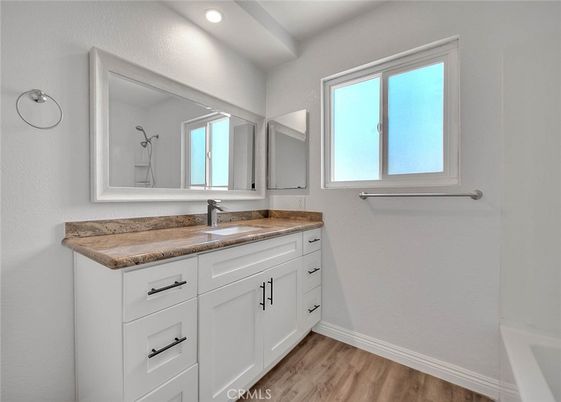 Bathroom, Dual Sink Vanities, Interior, Recessed Lighting, Wood Texture Flooring