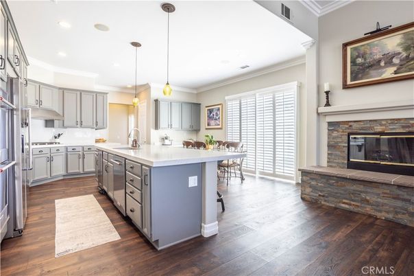 Fireplace, Interior, Kitchen, Pendant Lights, Recessed Lighting, Stainless Steel Appliances, Wood Texture Flooring