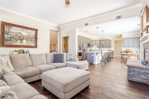 Dining room, Fireplace, Interior, Kitchen, Living room, Pendant Lights, Recessed Lighting, Stainless Steel Appliances, Wood Texture Flooring