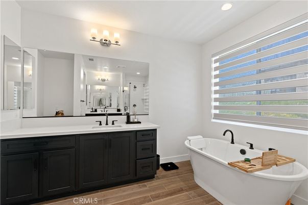 Bathroom, Dual Sink Vanities, Free Standing Baths, Interior, Recessed Lighting, Wood Texture Flooring