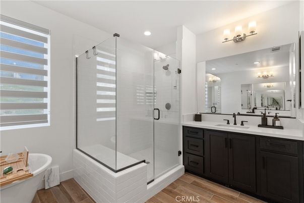 Bathroom, Dual Sink Vanities, Glass Shower, Interior, Recessed Lighting, Wood Texture Flooring