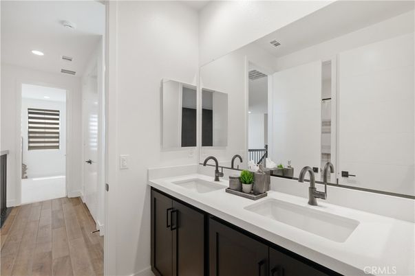 Bathroom, Dual Sink Vanities, Interior, Recessed Lighting, Wood Texture Flooring