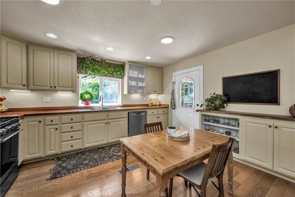 Dining room, Interior, Kitchen, Recessed Lighting, Stainless Steel Appliances, Wood Texture Flooring