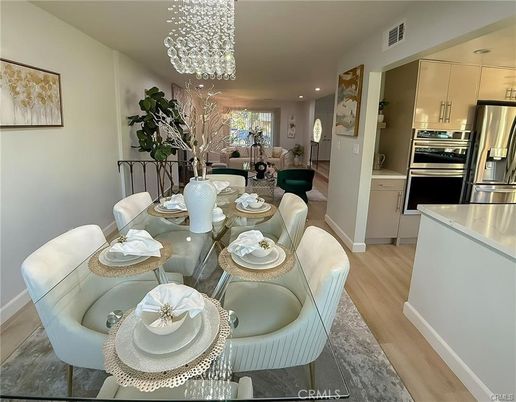 Dining room, Interior, Kitchen, Pendant Lights, Recessed Lighting, Stainless Steel Appliances, Wood Texture Flooring