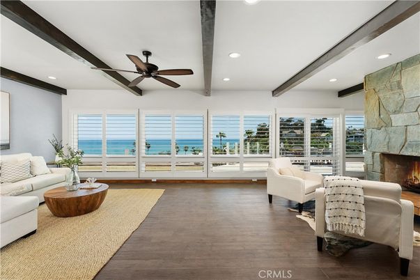 Fireplace, Interior, Living room, Recessed Lighting, Stone Walls, Water, Wooden Beams, Wood Texture Flooring