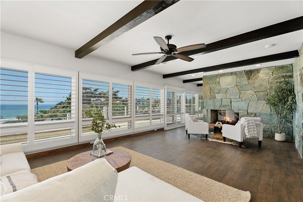 Fireplace, Interior, Living room, Recessed Lighting, Stone Walls, Water, Wooden Beams, Wood Texture Flooring