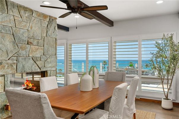 Dining room, Fireplace, Interior, Recessed Lighting, Stone Walls, Water, Wooden Beams, Wood Texture Flooring