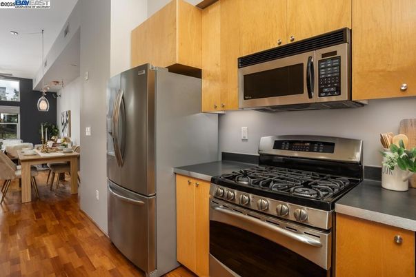 Dining room, Interior, Kitchen, Pendant Lights, Stainless Steel Appliances, Wood Texture Flooring