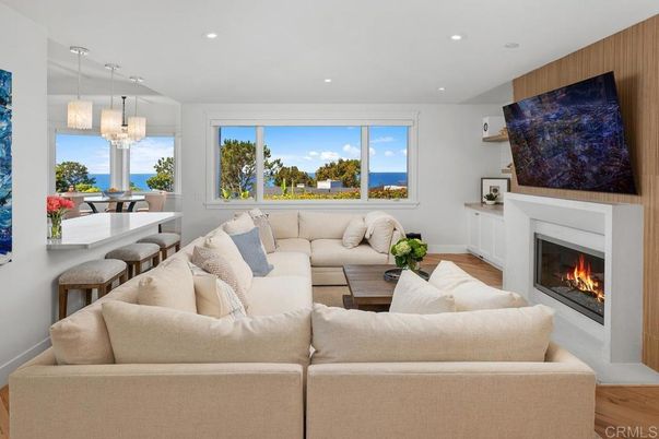 Chandelier, Dining room, Fireplace, Interior, Living room, Pendant Lights, Recessed Lighting, Water, Wood Texture Flooring
