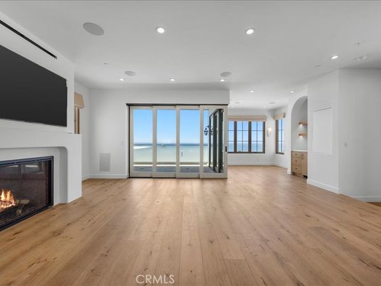 Empty room, Fireplace, Interior, Recessed Lighting, Water, Wood Texture Flooring
