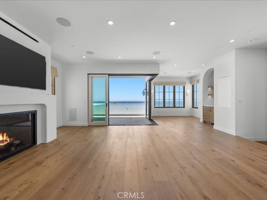 Empty room, Fireplace, Interior, Recessed Lighting, Water, Wood Texture Flooring