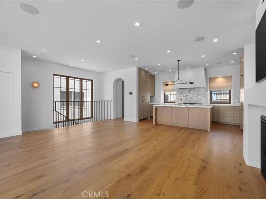 Interior, Kitchen, Marble Walls, Pendant Lights, Recessed Lighting, Stainless Steel Appliances, Wood Texture Flooring