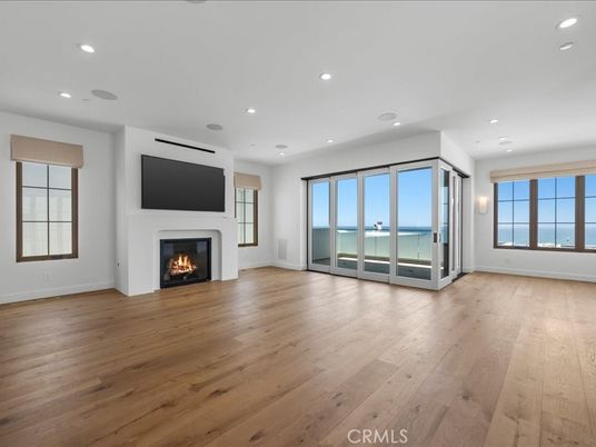 Empty room, Fireplace, Interior, Recessed Lighting, Water, Wood Texture Flooring