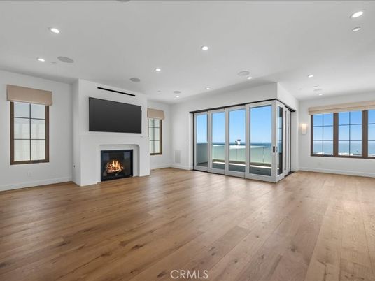 Empty room, Fireplace, Interior, Recessed Lighting, Water, Wood Texture Flooring