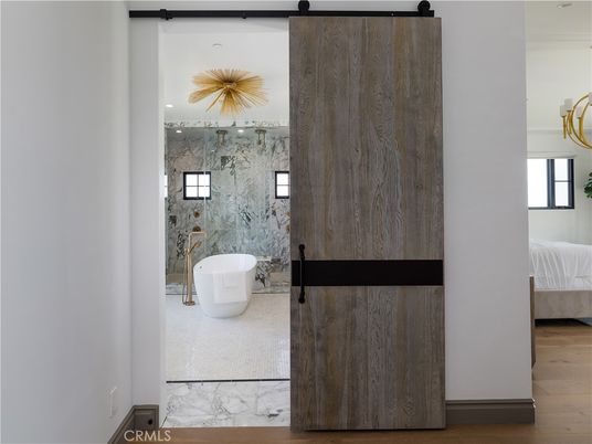 Bathroom, Free Standing Baths, Interior, Marble Walls, Recessed Lighting, Wood Texture Flooring