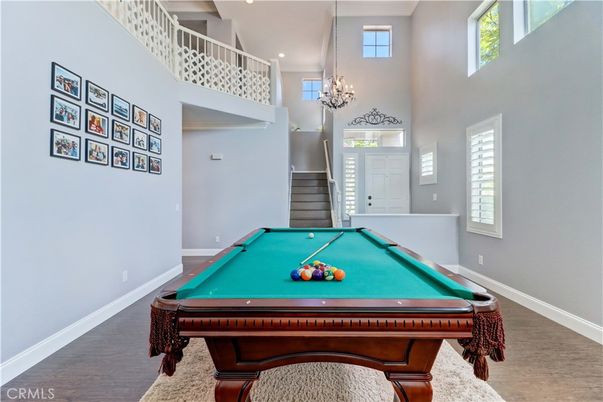 Billiard Table, Chandelier, Game Room, Interior, Pendant Lights, Recessed Lighting, Wood Texture Flooring