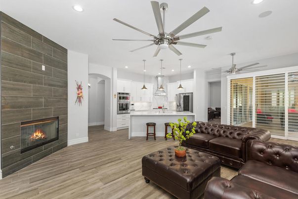 Fireplace, Interior, Kitchen, Living room, Pendant Lights, Recessed Lighting, Stainless Steel Appliances, Wood Texture Flooring