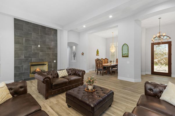 Chandelier, Dining room, Fireplace, Interior, Living room, Pendant Lights, Recessed Lighting, Wood Texture Flooring