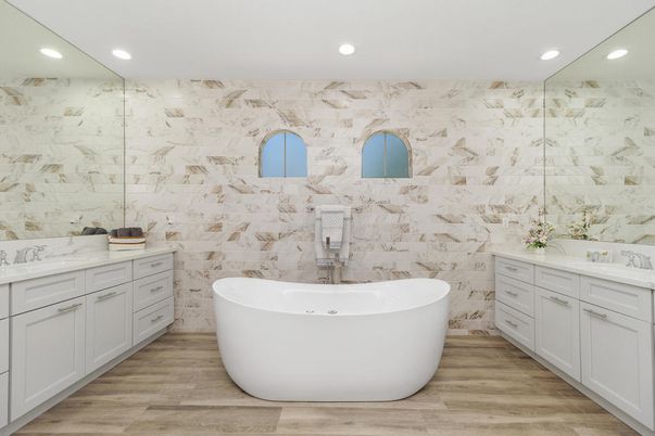 Bathroom, Dual Sink Vanities, Free Standing Baths, Glass Shower, Interior, Marble Walls, Recessed Lighting, Wood Texture Flooring
