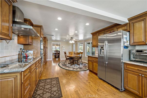 Dining room, Interior, Kitchen, Recessed Lighting, Stainless Steel Appliances, Wood Texture Flooring