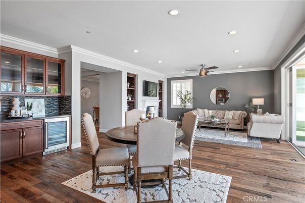 Dining room, Fireplace, Interior, Living room, Recessed Lighting, Wood Texture Flooring