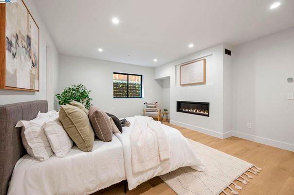 Bedroom, Fireplace, Interior, Recessed Lighting, Wood Texture Flooring