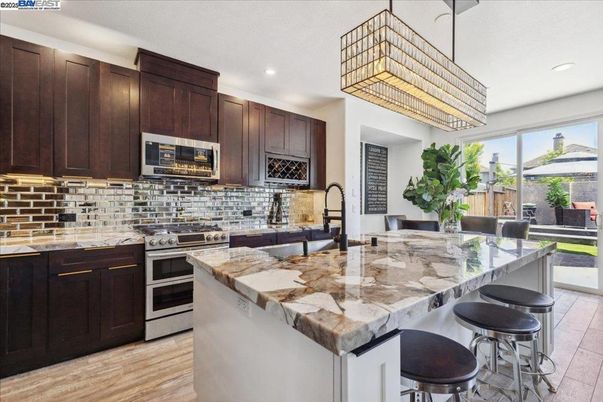 Chandelier, Interior, Kitchen, Recessed Lighting, Stainless Steel Appliances, Wood Texture Flooring