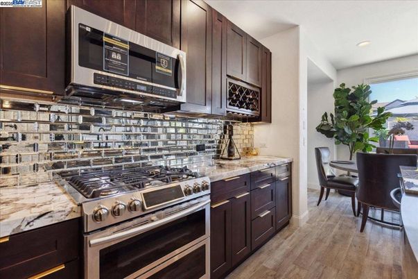 Dining room, Interior, Kitchen, Recessed Lighting, Stainless Steel Appliances, Wood Texture Flooring