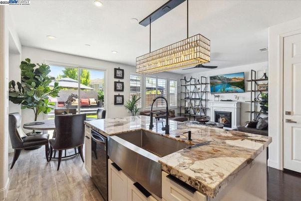 Chandelier, Dining room, Fireplace, Interior, Kitchen, Recessed Lighting, Wood Texture Flooring