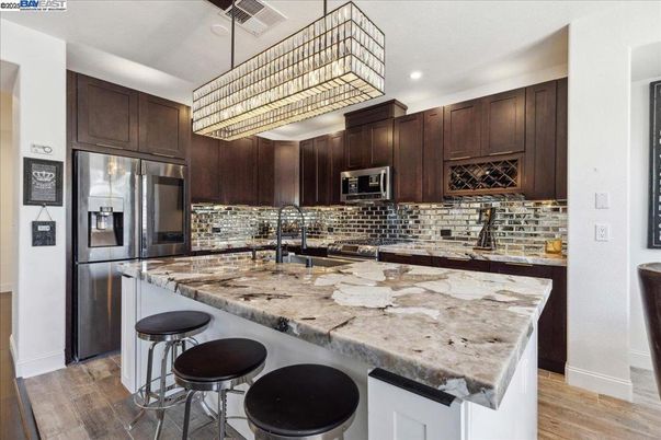 Chandelier, Interior, Kitchen, Recessed Lighting, Stainless Steel Appliances, Wood Texture Flooring