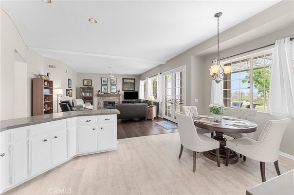 Dining room, Fireplace, Interior, Living room, Pendant Lights, Recessed Lighting, Wood Texture Flooring