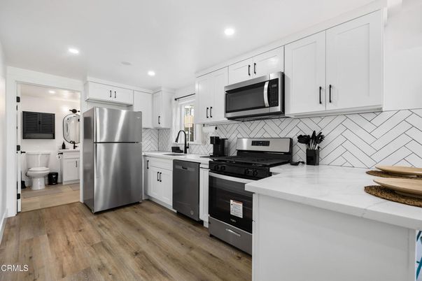 Interior, Kitchen, Recessed Lighting, Stainless Steel Appliances, Wood Texture Flooring