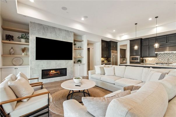 Fireplace, Interior, Kitchen, Living room, Pendant Lights, Recessed Lighting, Stainless Steel Appliances, Wood Texture Flooring