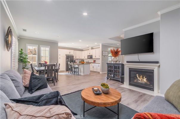 Dining room, Fireplace, Interior, Kitchen, Living room, Recessed Lighting, Stainless Steel Appliances, Wood Texture Flooring