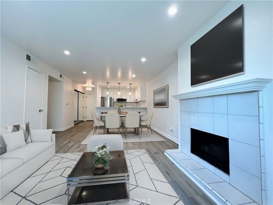 Dining room, Fireplace, Interior, Kitchen, Living room, Pendant Lights, Recessed Lighting, Stainless Steel Appliances, Wood Texture Flooring