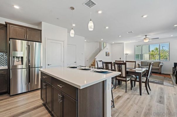 Dining room, Interior, Kitchen, Pendant Lights, Recessed Lighting, Stainless Steel Appliances, Wood Texture Flooring